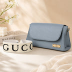 Nomad Stylish Light Blue Shoulder Bag – Flap-Over Baguette with Wide Fabric Strap